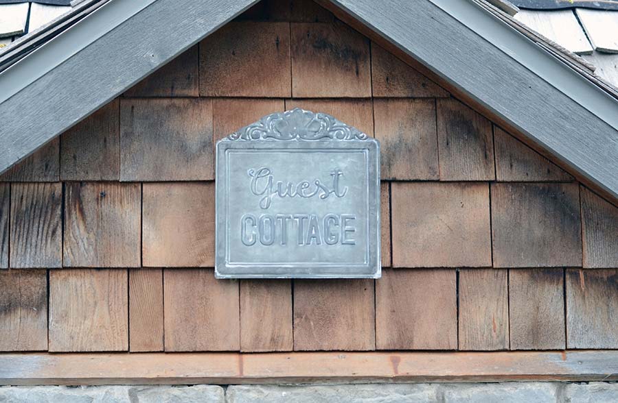 Guest Cottage Embossed Tin Sign